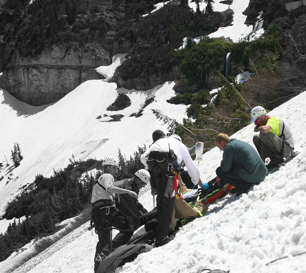 SAR medical team treating a patient in the backcountry